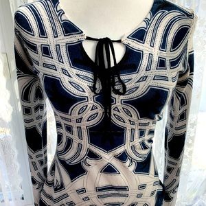 RED design woman’s sweater with blue and black designs.
